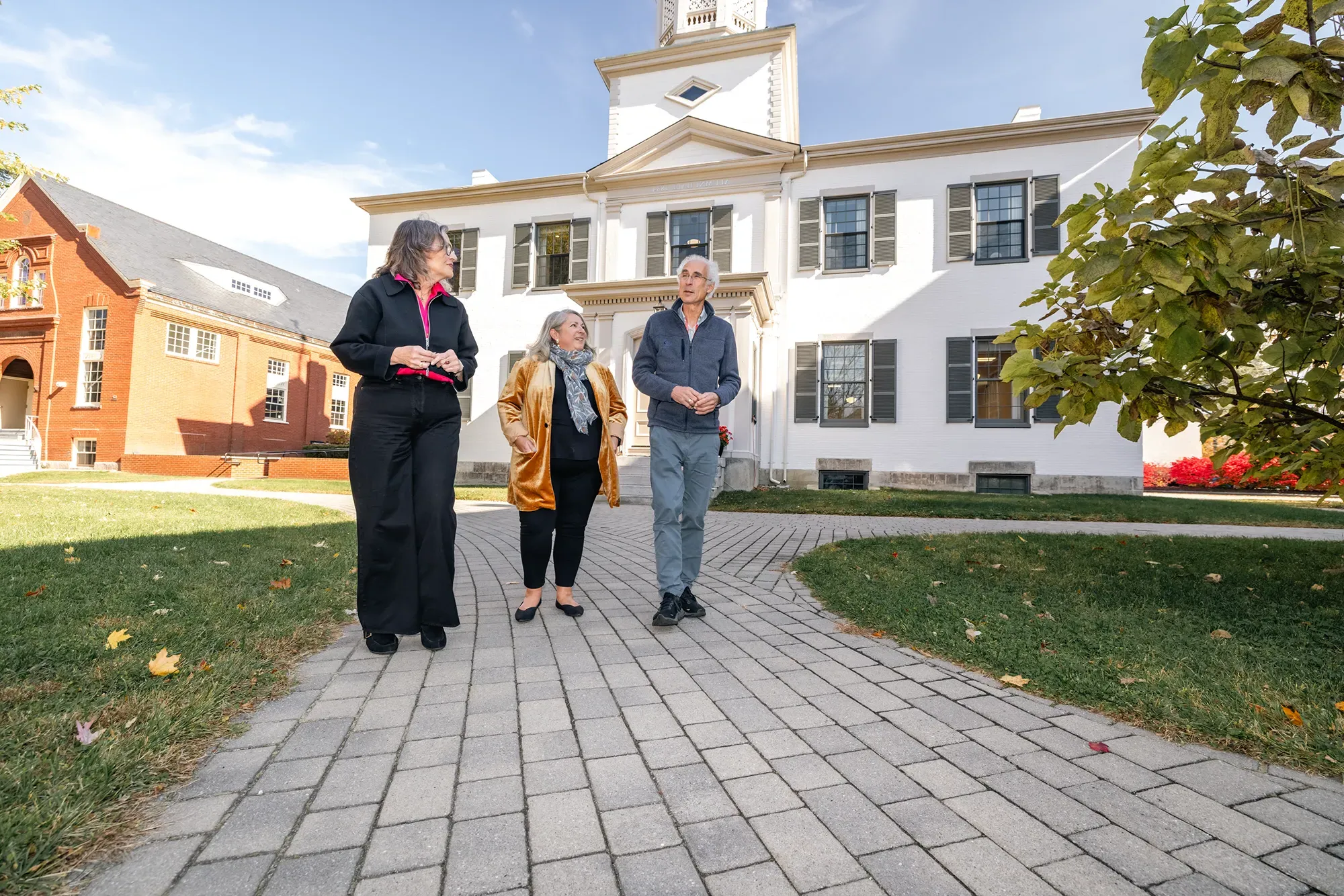 Clifford Rosen, M.D., MaineHealth Institute for Research; Gwendolyn Mahon, UNE; and Karen Houseknecht, UNE, stroll and speak about research collaborations