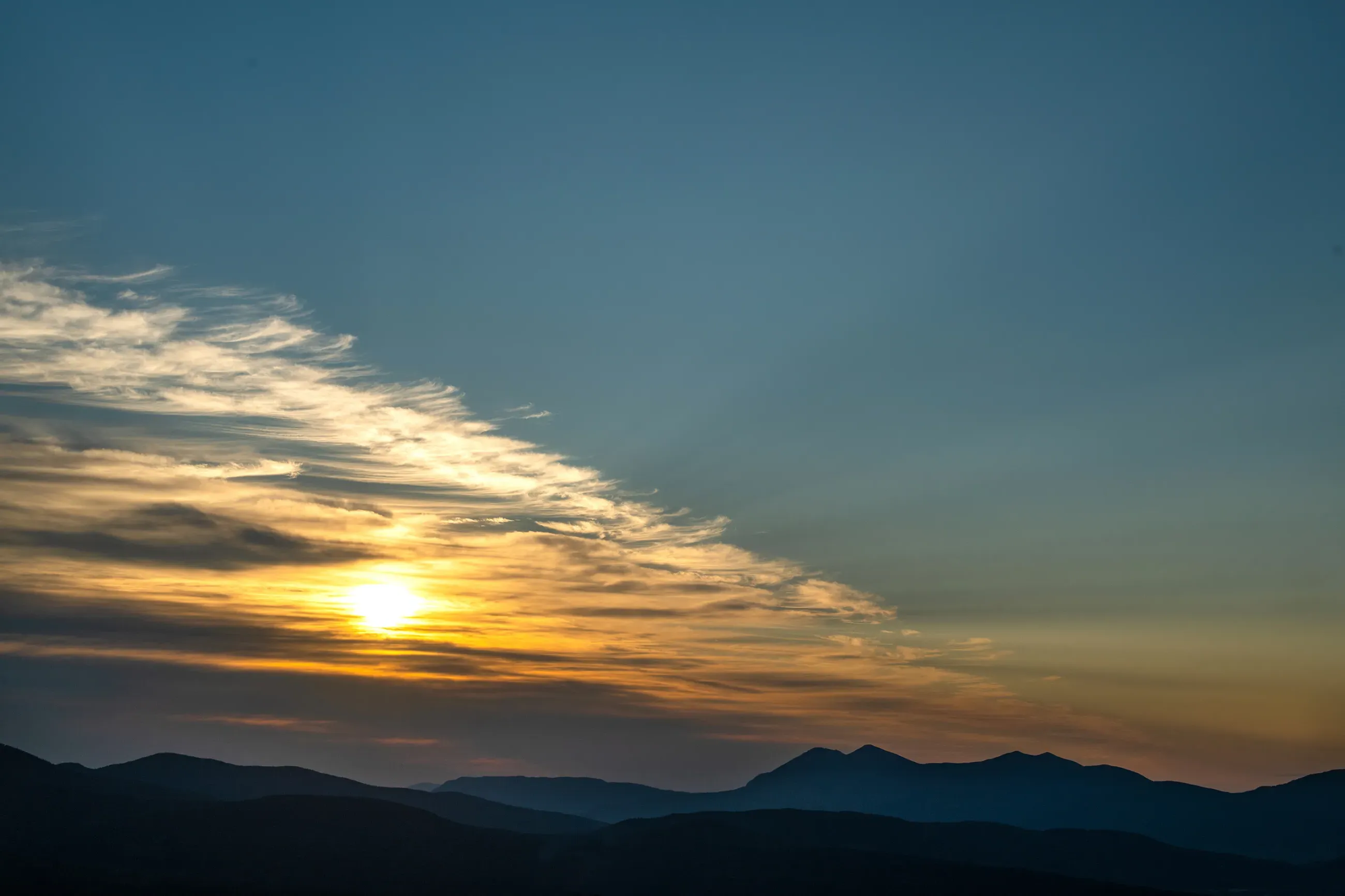 The sunrise over the Bigelow Preserve mountains